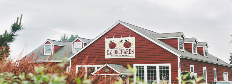 EZ Orchards Store front with red flowers EZ Orchards Store front with red flowers